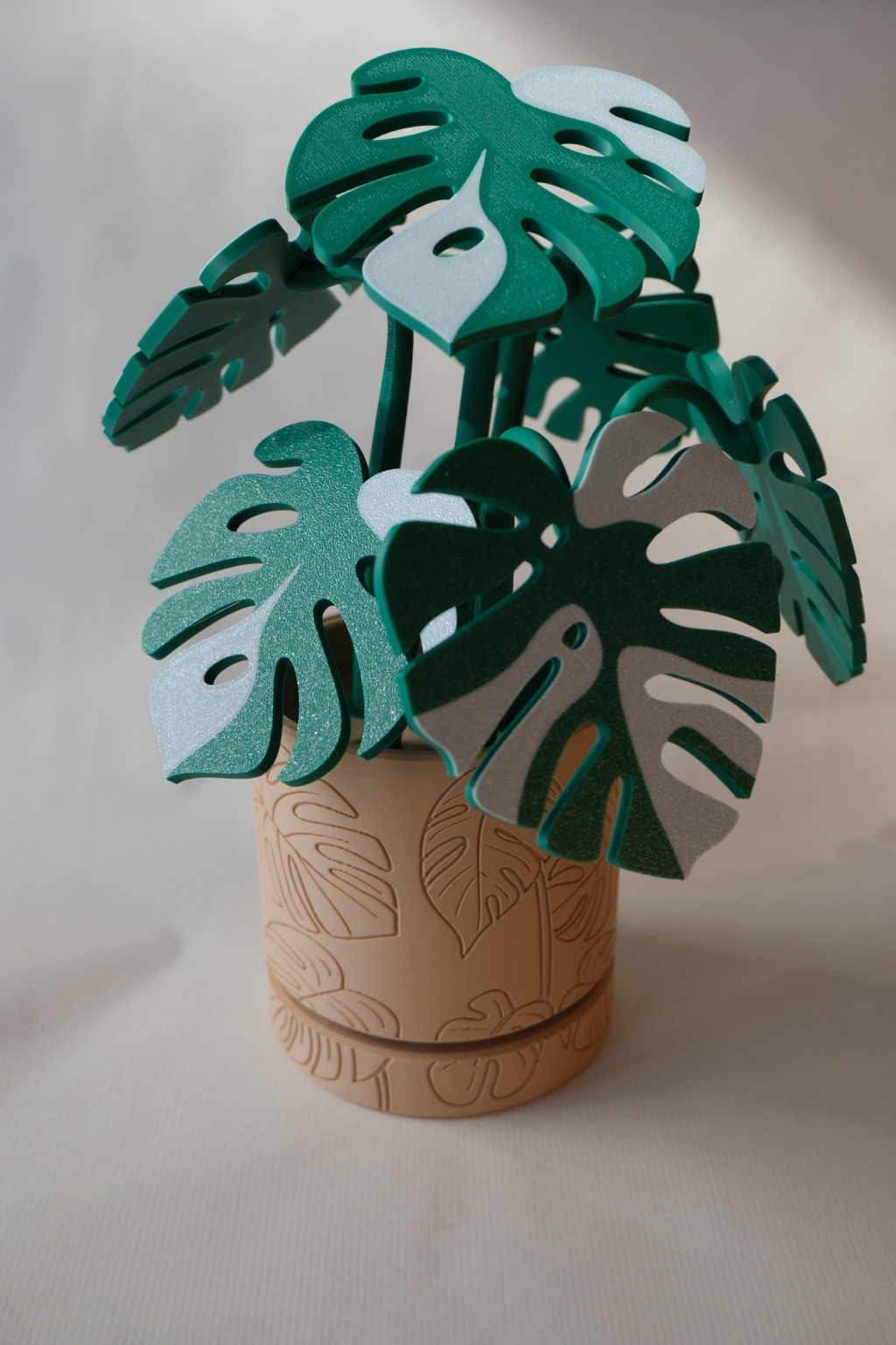 3D printed monstera plant decoration in a patterned pot