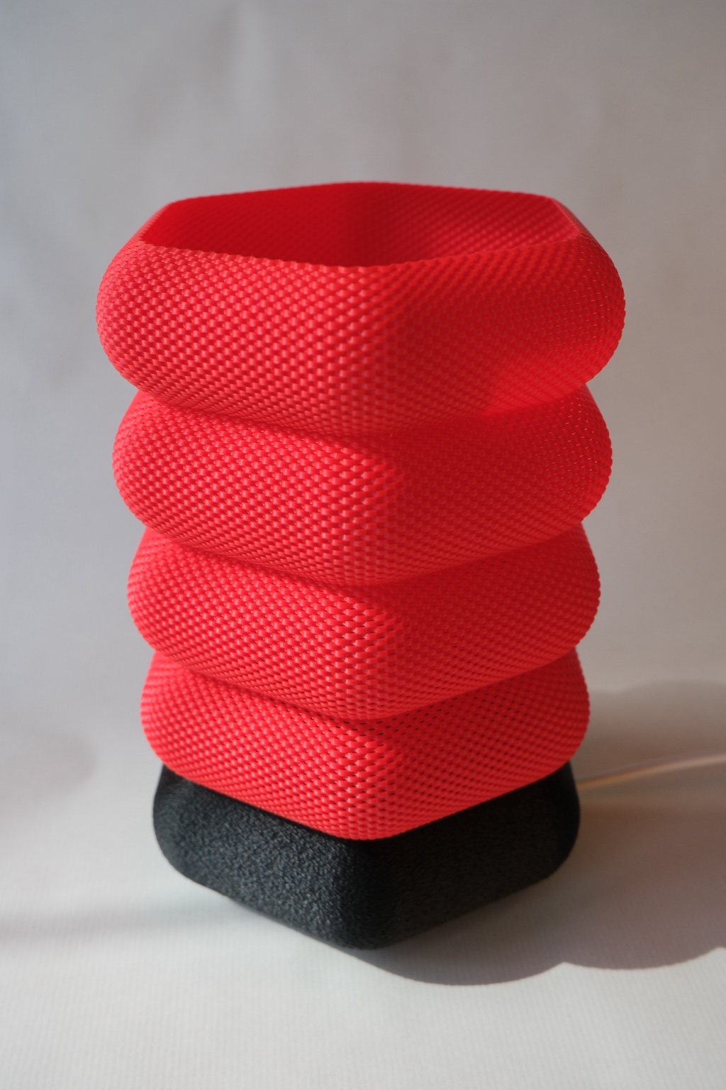 Red Nobu3D textured lamp with black base